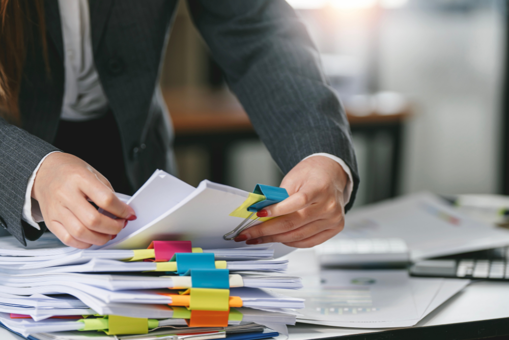 image of someone preparing paperwork for their manuscript